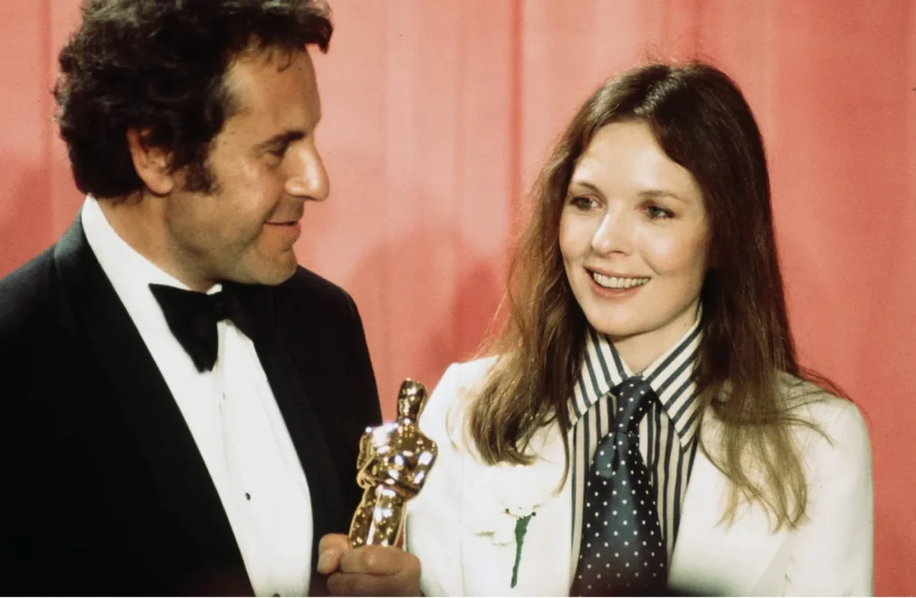 Milos Forman and Diane Keaton backstage after winning an award at the 48th Academy Awards in Los Angeles, 1976 | Source: Getty Images